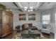 Cozy living room with coffered ceilings, hardwood floors, and decorative accents at 4685 Orchard View Way, Cumming, GA 30028