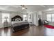 Serene main bedroom with hardwood floors, tray ceilings, and plenty of natural light at 4685 Orchard View Way, Cumming, GA 30028