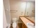 Bathroom with a toilet, sink, and mirror at 3301 Henderson Mill Rd # 1, Atlanta, GA 30341