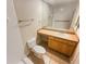 Simple bathroom with beige vanity countertop, sink and wood cabinets; a large mirror spans the vanity at 3301 Henderson Mill Rd # 1, Atlanta, GA 30341