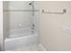 Updated bathroom featuring a combination tub and shower with new fixtures and a tiled shower surround at 3301 Henderson Mill Rd # 1, Atlanta, GA 30341
