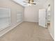 Carpeted bedroom with a ceiling fan and bright natural light at 3301 Henderson Mill Rd # 1, Atlanta, GA 30341