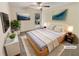 Staged bedroom featuring neutral walls and ceiling fan and bright window at 3301 Henderson Mill Rd # 1, Atlanta, GA 30341
