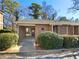 Charming brick townhouse with covered entryway and well-maintained landscaping at 3301 Henderson Mill Rd # 1, Atlanta, GA 30341