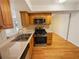 Kitchen with stainless steel oven and wood cabinets at 3301 Henderson Mill Rd # 1, Atlanta, GA 30341