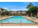 Inviting community pool with lounge chairs and manicured landscaping under a clear blue sky at 3301 Henderson Mill Rd # 1, Atlanta, GA 30341