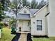 Inviting home featuring a charming exterior with a well-manicured lawn and attractive architectural details at 5980 Sherwood Trce, Lithonia, GA 30038