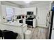 Updated kitchen featuring granite counters, stainless steel appliances, and ample cabinet space at 5980 Sherwood Trce, Lithonia, GA 30038