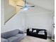 Spacious living room with vaulted ceilings, staircase, and sleek furniture arrangement at 5980 Sherwood Trce, Lithonia, GA 30038