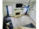 Bright living room featuring a cozy fireplace, a modern ceiling fan, and stylish decor at 5980 Sherwood Trce, Lithonia, GA 30038