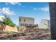View of the home with a backyard deck and a spacious grassy area at 6463 Century Park Se Pl, Mableton, GA 30126