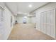 Finished basement area with carpet flooring, neutral paint, and ample space for recreation at 6463 Century Park Se Pl, Mableton, GA 30126