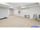 Finished basement area with carpet flooring, neutral paint, and ample space for recreation at 6463 Century Park Se Pl, Mableton, GA 30126