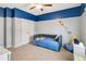bedroom featuring blue and neutral walls, carpet, and a closet at 6463 Century Park Se Pl, Mableton, GA 30126