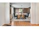 Elegant dining room featuring modern chandelier, stylish seating, and a large window for natural light at 6463 Century Park Se Pl, Mableton, GA 30126