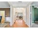 Inviting entryway with hardwood floors flowing into a bright living space, showcasing an open floor plan at 6463 Century Park Se Pl, Mableton, GA 30126