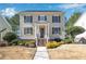 Charming two-story home with a manicured front yard and inviting entrance with brick steps at 6463 Century Park Se Pl, Mableton, GA 30126