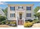 Inviting two-story home featuring an elegant front porch and professionally landscaped yard at 6463 Century Park Se Pl, Mableton, GA 30126