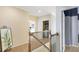 Upstairs hallway featuring a laundry room and a bedroom that leads to the staircase at 6463 Century Park Se Pl, Mableton, GA 30126