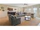 Spacious living room with ample seating, large windows, and an open layout perfect for entertaining at 6463 Century Park Se Pl, Mableton, GA 30126