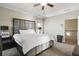 Spacious main bedroom features a tray ceiling, carpeting, and a large upholstered headboard at 6463 Century Park Se Pl, Mableton, GA 30126