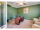 Spacious office with a ceiling fan, desk and comfortable seating, perfect for working from home at 6463 Century Park Se Pl, Mableton, GA 30126