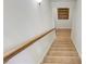 Carpeted staircase with wood railing leading to the upper level of the home at 6463 Century Park Se Pl, Mableton, GA 30126