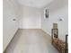A clean room with shiplap accent wall, a small window, and added woodpile storage area at 6463 Century Park Se Pl, Mableton, GA 30126