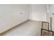 A clean room with shiplap accent wall, and a small window to provide added light at 6463 Century Park Se Pl, Mableton, GA 30126