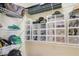 Closet with well-organized shelving with clear containers, providing storage for shoes and other items at 6463 Century Park Se Pl, Mableton, GA 30126