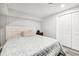 Bright bedroom with a plush bed, closet, and neutral walls at 100 Charlotte Sw Dr, Mableton, GA 30126