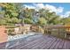 Inviting wooden deck, perfect for outdoor relaxation with a table and chairs at 100 Charlotte Sw Dr, Mableton, GA 30126