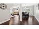 Open-concept dining room with hardwood floors, modern lighting, and access to the living room at 100 Charlotte Sw Dr, Mableton, GA 30126