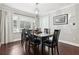 Formal dining room with hardwood floors, modern lighting, and bright windows at 100 Charlotte Sw Dr, Mableton, GA 30126