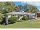 View of a well-maintained home featuring a driveway and landscaping at 100 Charlotte Sw Dr, Mableton, GA 30126