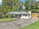 Charming home with a classic front porch and long driveway at 100 Charlotte Sw Dr, Mableton, GA 30126