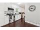 Well-lit kitchen featuring granite countertops, stainless steel appliances, and white cabinetry at 100 Charlotte Sw Dr, Mableton, GA 30126