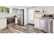 Well-lit kitchenette features stainless steel appliances and granite countertops at 100 Charlotte Sw Dr, Mableton, GA 30126