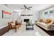 Cozy living room featuring a stone fireplace, modern furniture, and stylish decor at 100 Charlotte Sw Dr, Mableton, GA 30126