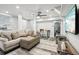 Bright, open-concept living room features comfortable seating and plenty of natural light at 100 Charlotte Sw Dr, Mableton, GA 30126
