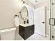 Modern bathroom featuring a sleek vanity, stylish mirror, and white marble tile at 1751 Carter Cir, Atlanta, GA 30344