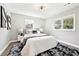 Bright bedroom with a plush rug, neutral decor, and natural light from the windows at 1751 Carter Cir, Atlanta, GA 30344