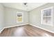 Bright, neutral bedroom with luxury vinyl plank flooring and sunlit windows at 1751 Carter Cir, Atlanta, GA 30344
