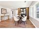 Bright dining room with a stylish table, decor fireplace, and sunlit windows at 1751 Carter Cir, Atlanta, GA 30344