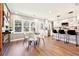 Bright open kitchen with stainless appliances, island seating, and adjacent dining area at 1751 Carter Cir, Atlanta, GA 30344