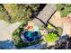 Aerial view of backyard featuring a pool, patio, lush landscaping, and mature trees at 2962 Norman Cir, Duluth, GA 30096