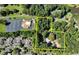 Aerial view showing the lot line with mature trees and a house with a pool at 2962 Norman Cir, Duluth, GA 30096