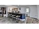 Finished basement with a bar, stools, mini fridge, and door to the exterior at 2962 Norman Cir, Duluth, GA 30096