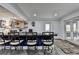 Finished basement with a wet bar, stools, and an exterior access through glass doors at 2962 Norman Cir, Duluth, GA 30096