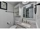 Bright bathroom with a granite countertop, modern fixtures, and ample storage space at 2962 Norman Cir, Duluth, GA 30096